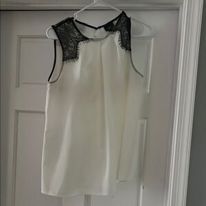 Elegant Cream Sleeveless Top with Black Lace